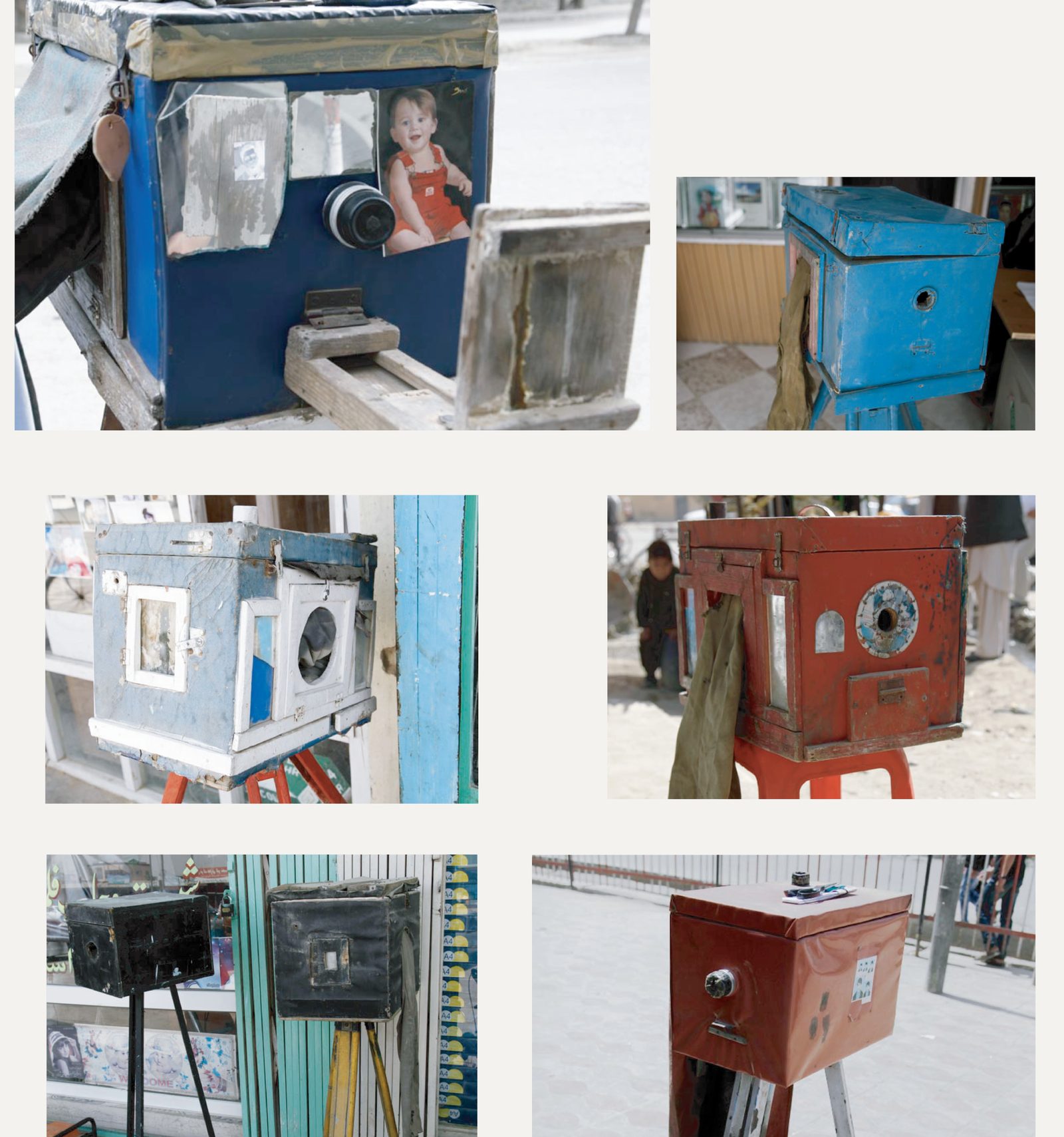 Box cameras across Afghanistan — blue, red, black; each its maker’s own.