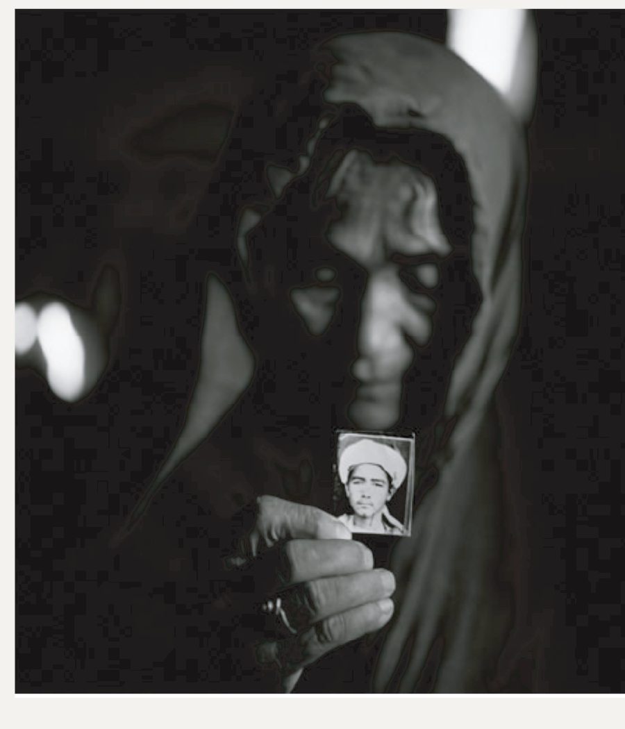 Kurban Gul with the only surviving portrait of her son.